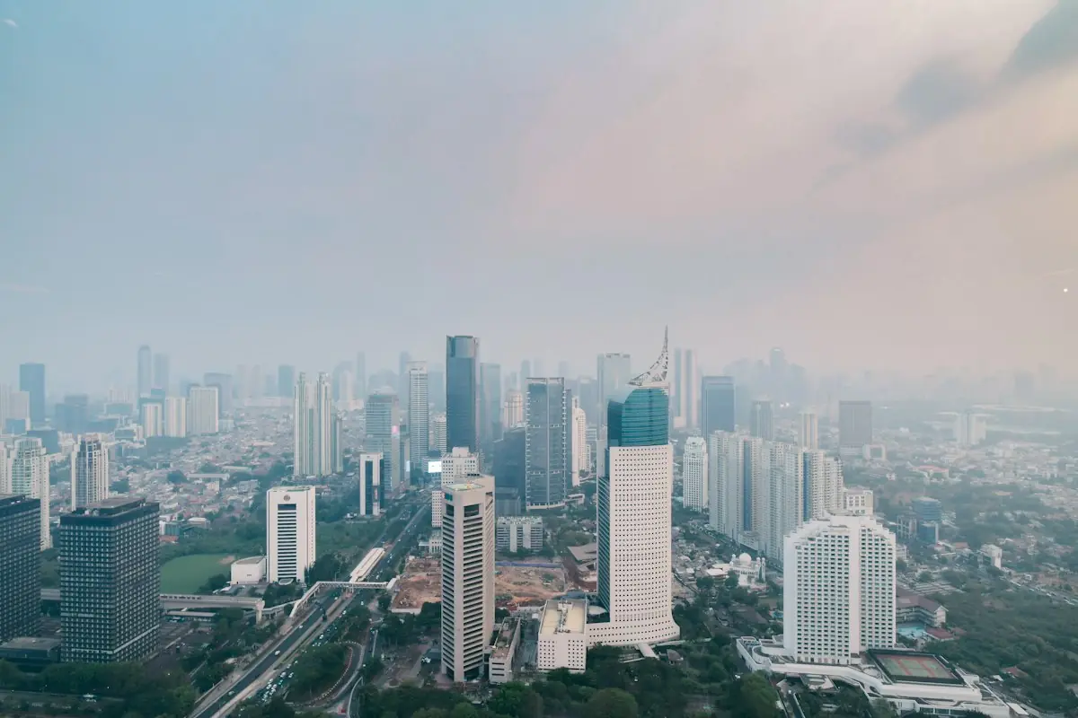 The Jakarta skyline under a hazy sky
