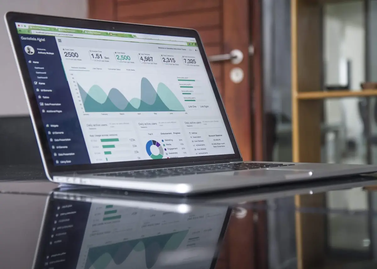 An investment dashboard open on a laptop
