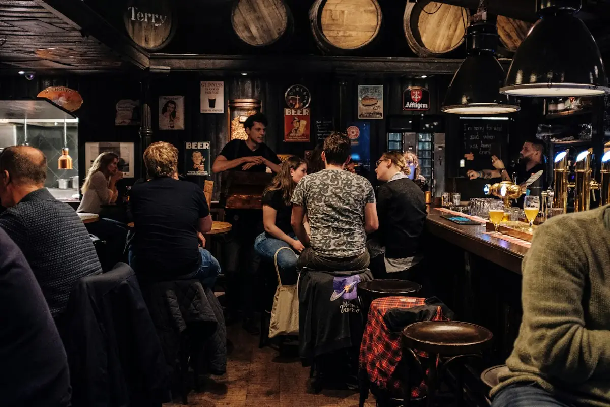 Football fans watching a match in a pub