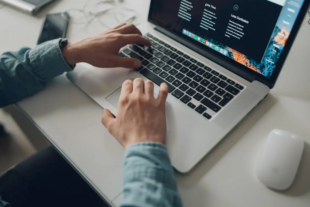 Someone searching the web on a laptop