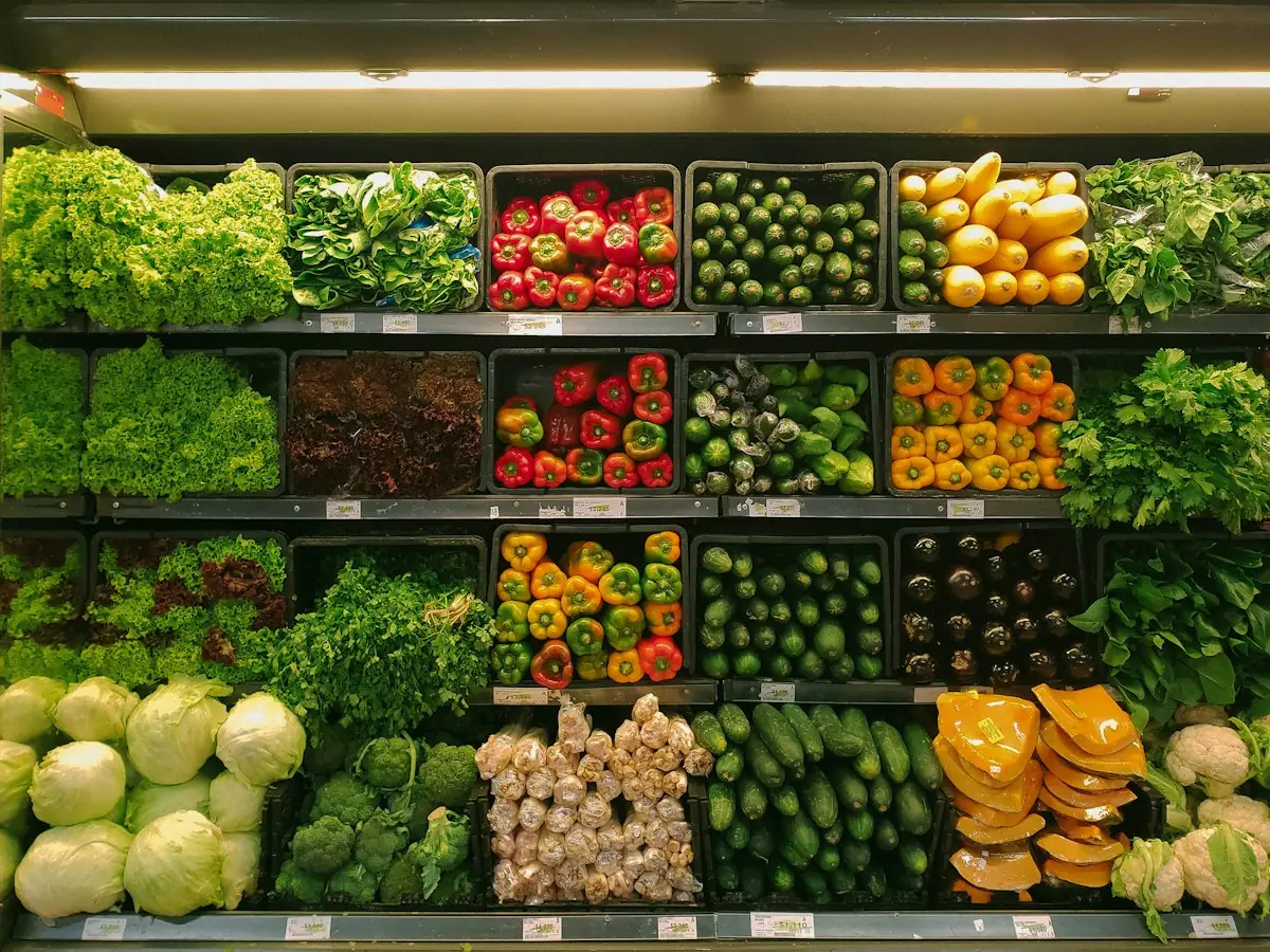 Fresh vegetables stacked on supermarket shelves