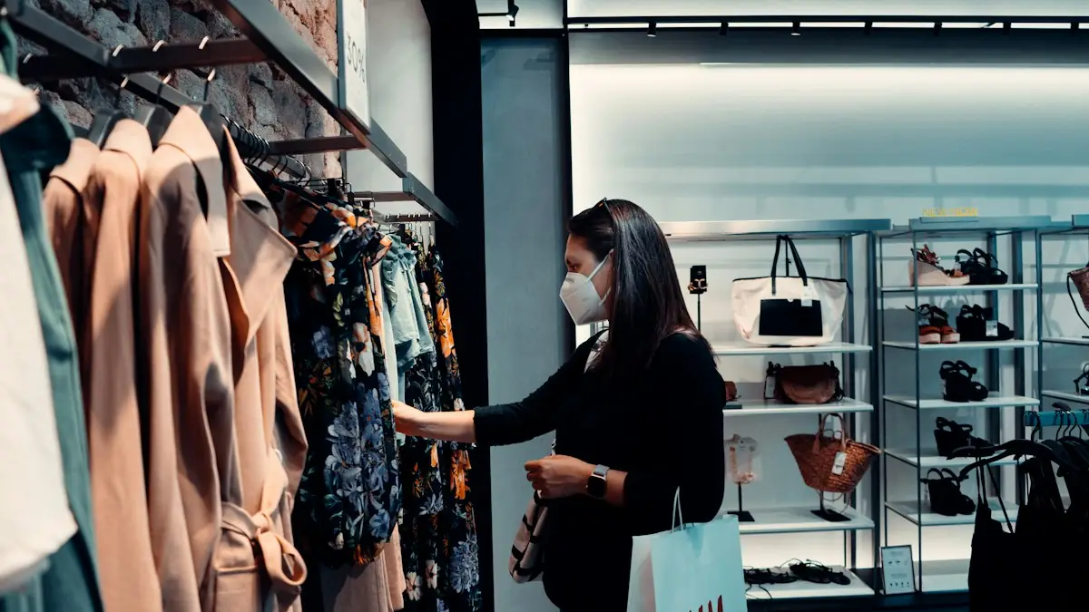 A woman in a face mask shopping for clothes