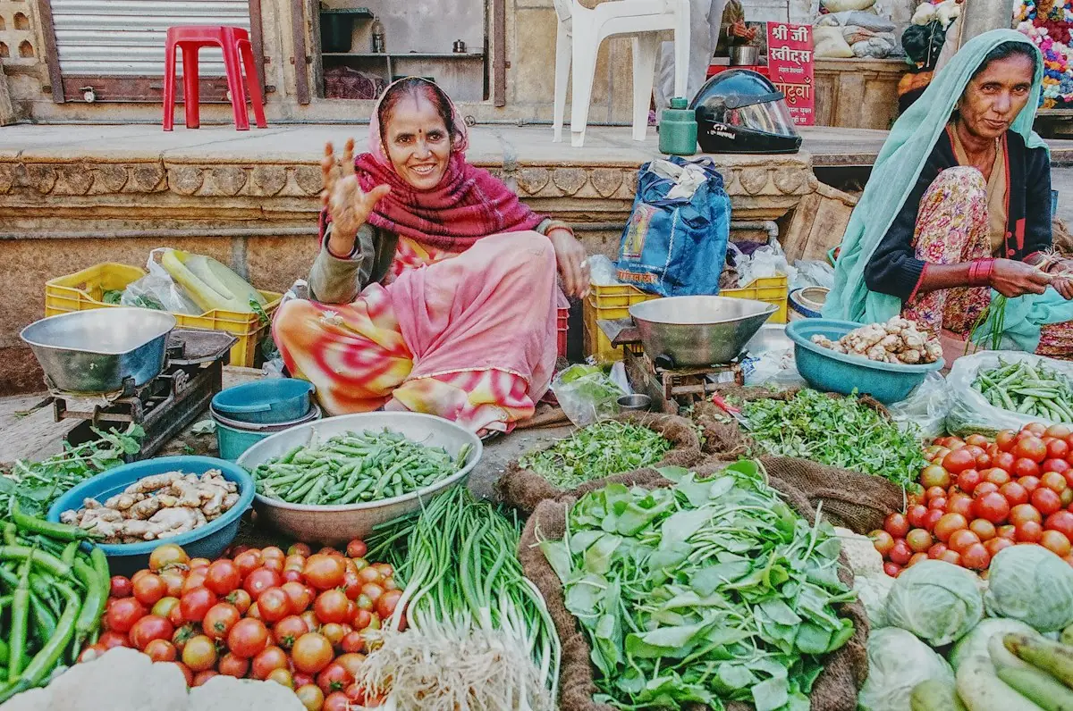 Women selling fresh vegetables at an Indian market