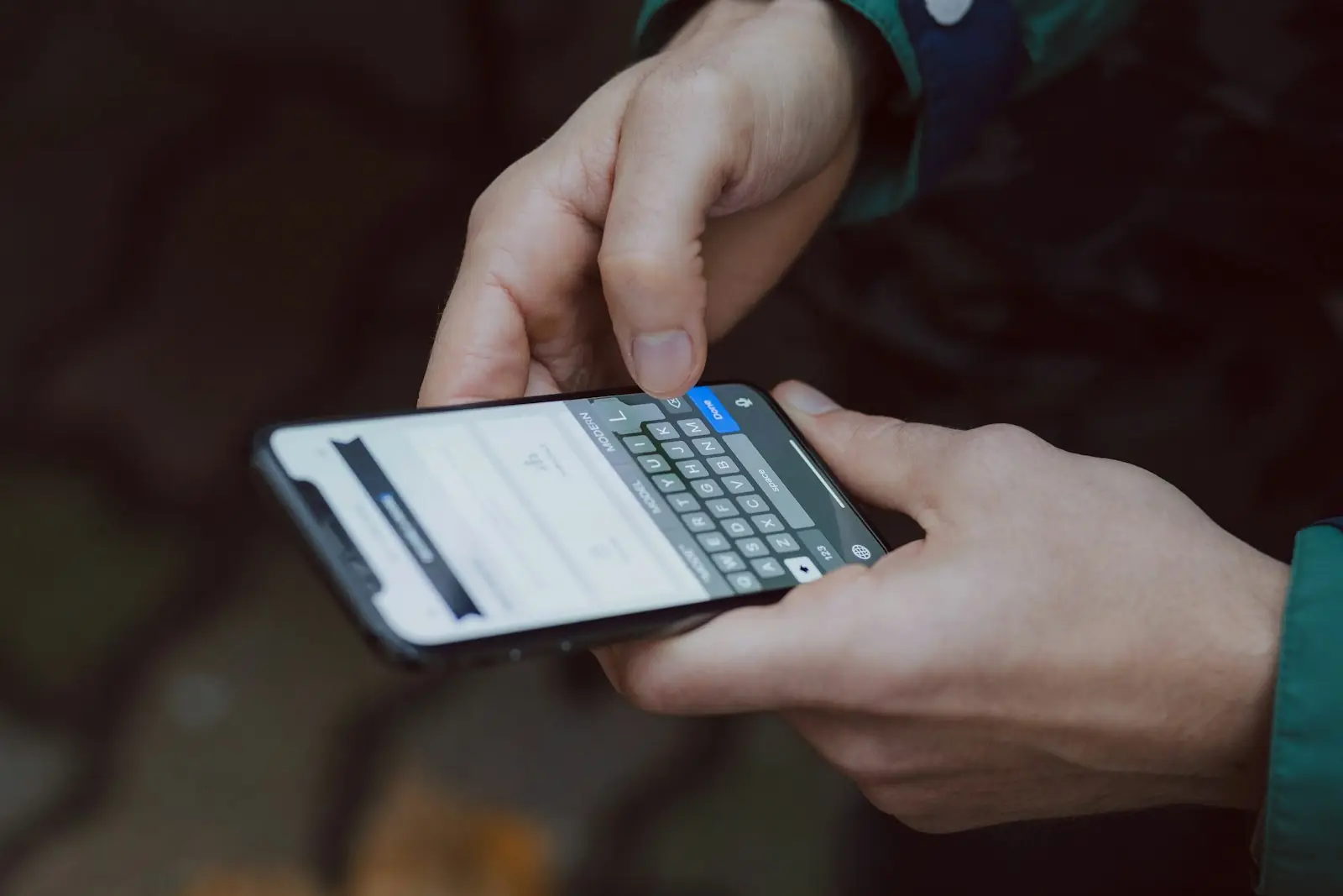 A person typing on a smartphone