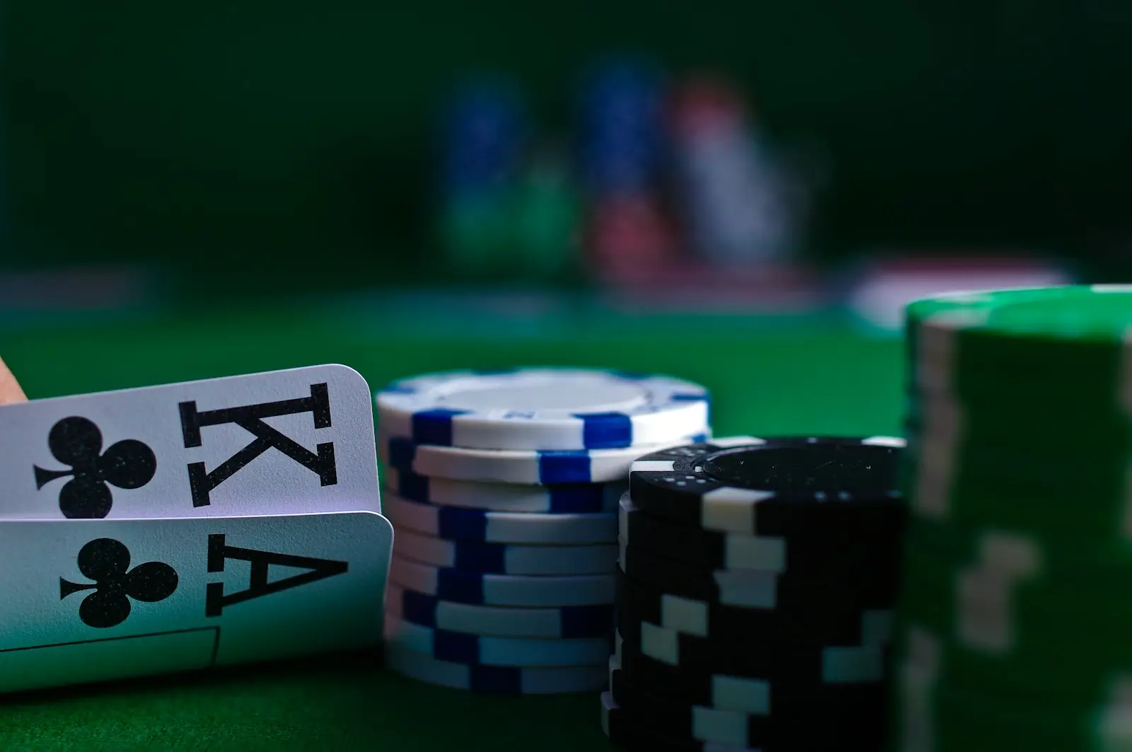 A poker hand of king and ace beside stacks of chips