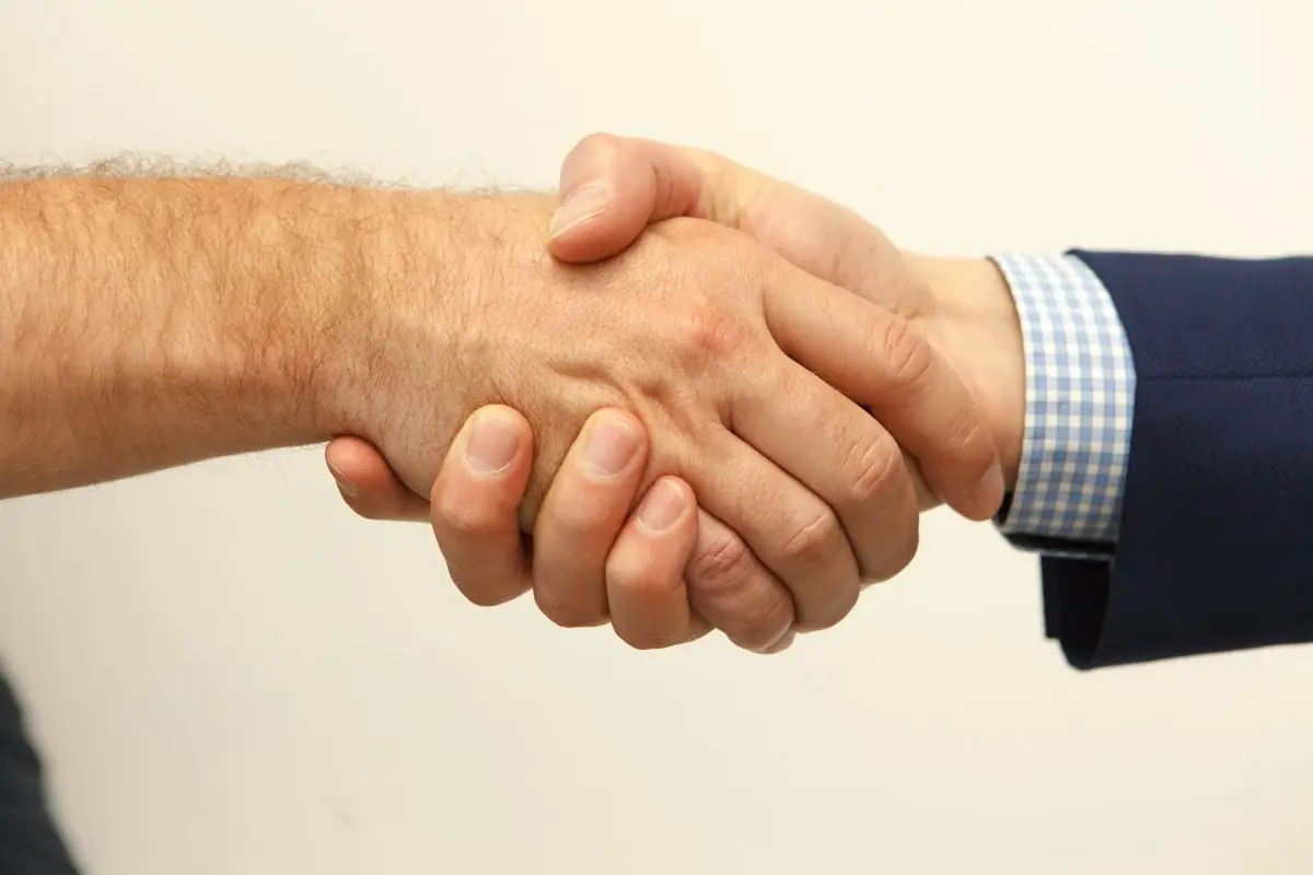 Business partners shaking hands