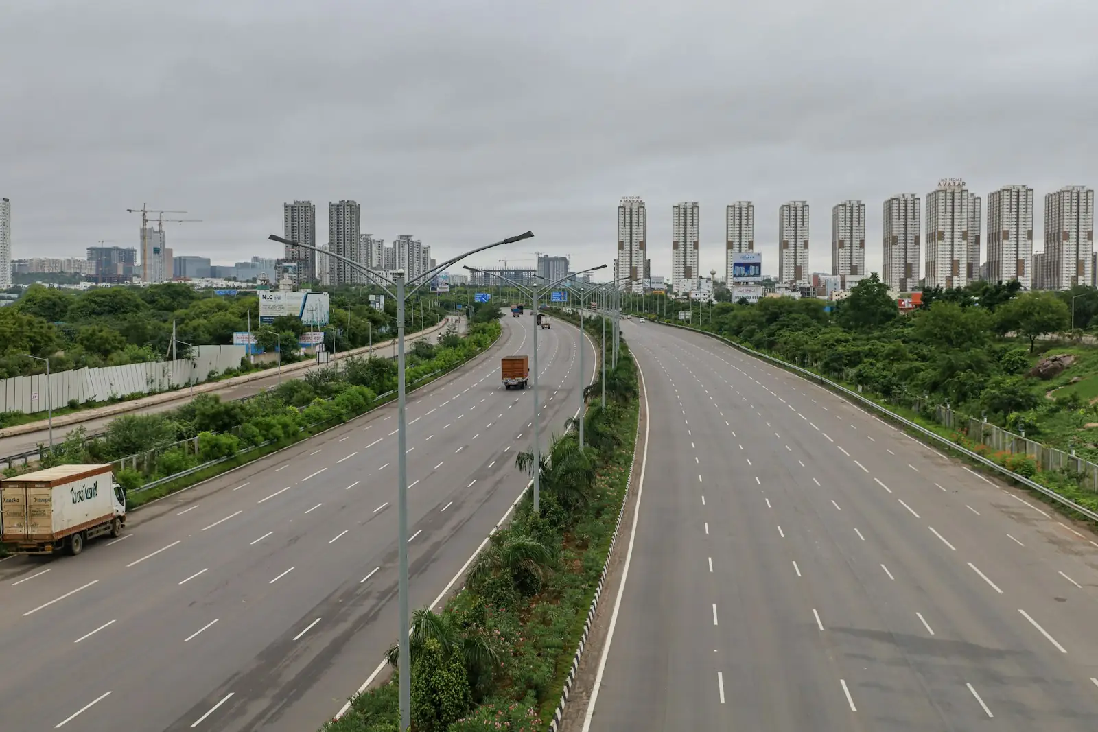 An empty highway leading into an Indian city