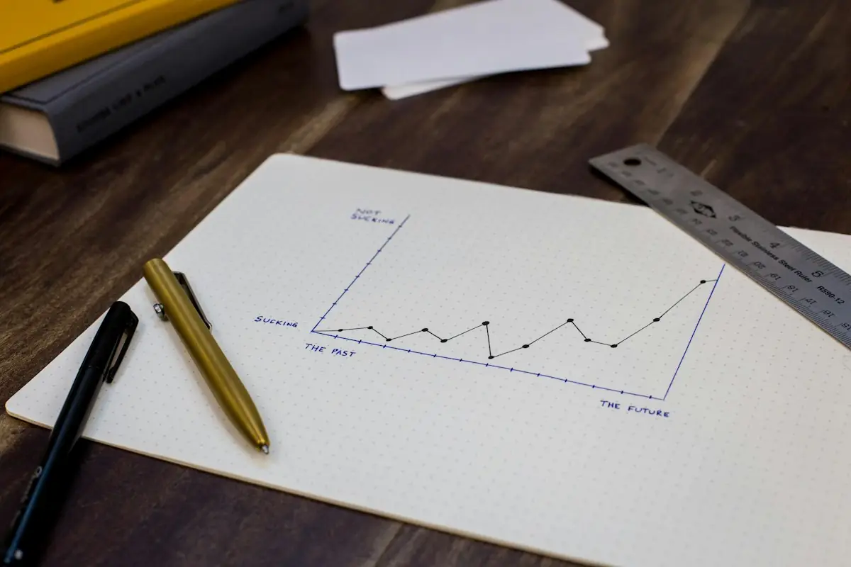 A hand-drawn growth chart on paper with a pen