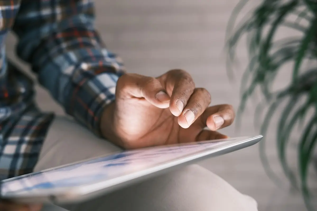 A hand scrolling on a tablet