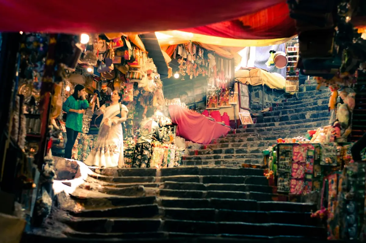 A colourful textile market stall on a stairway
