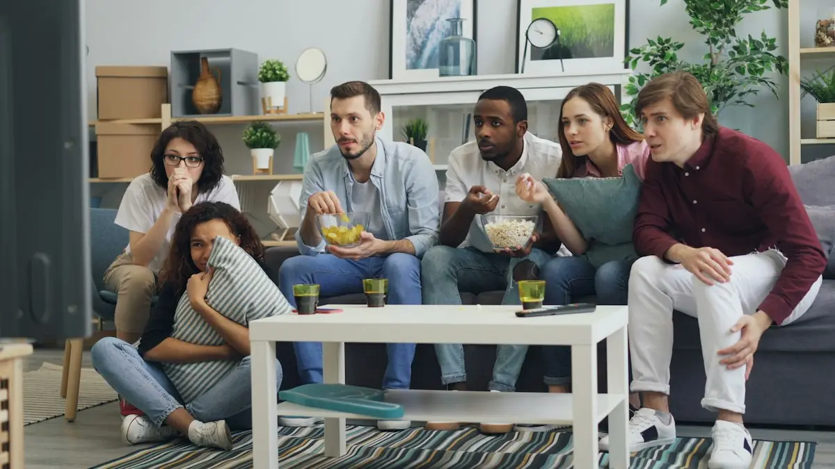 Friends watching a match together on the sofa