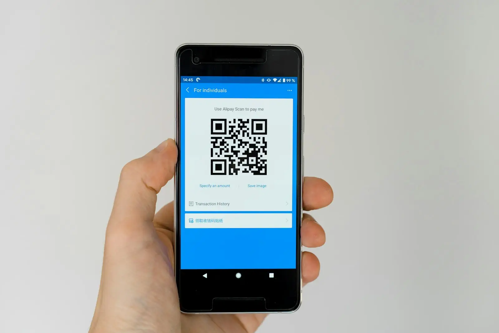 A phone showing a QR code for payment