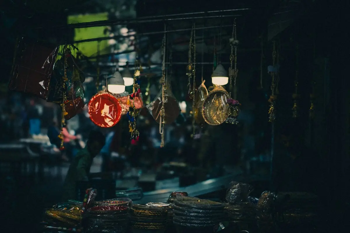 A street vendor's stall lit with lanterns at night