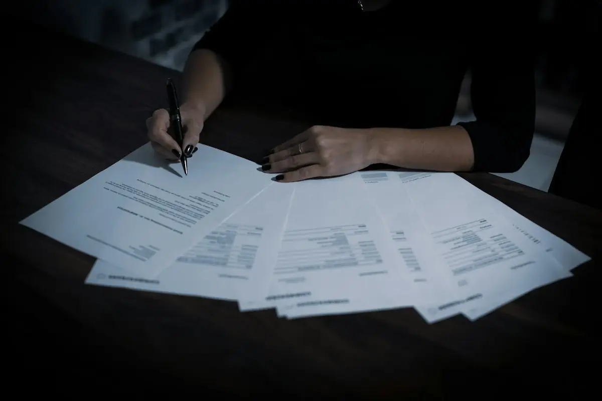 Signing insurance papers at a table