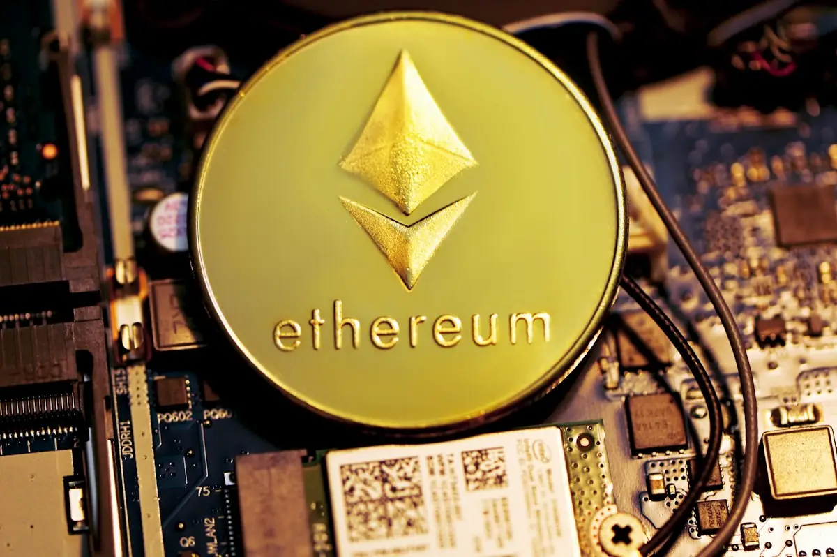 A gold Ethereum coin on a circuit board