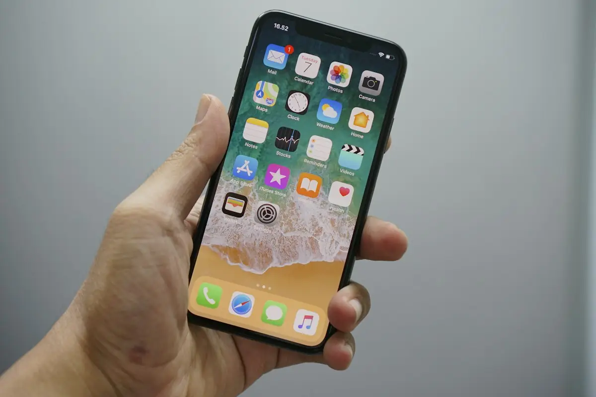 A phone's home screen full of apps