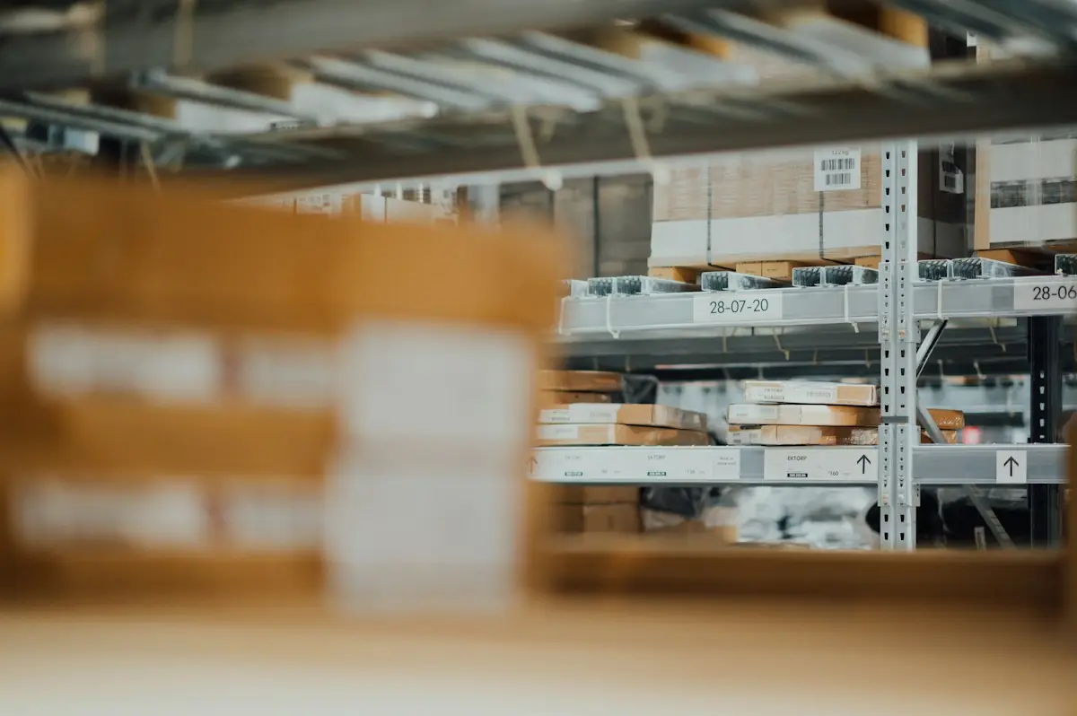 Parcels on warehouse shelving, out of focus