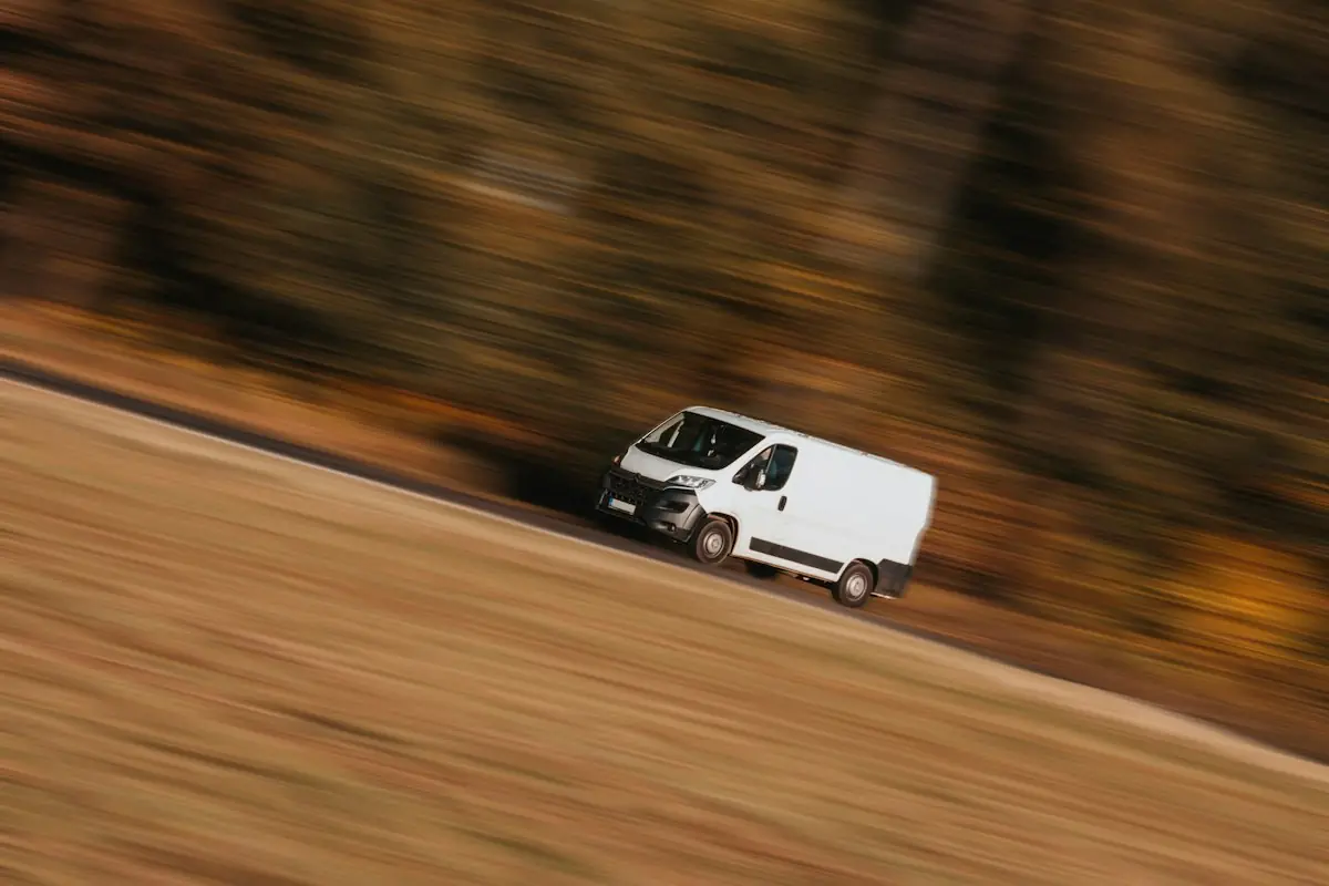 A white delivery van on the move