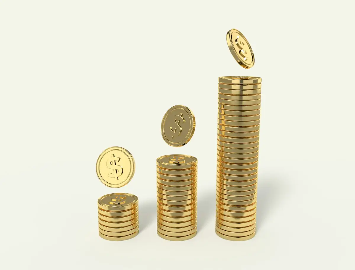Stacks of gold coins rising from short to tall